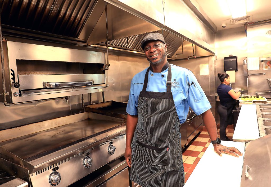 Independent restaurant operator standing in a working kitchen